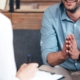 Man engaged in a CBT therapy session, seeking treatment for PTSD, showcasing resilience and hope.