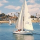 Sailboats gracefully floating on the serene waters near LIDO Wellness Center, symbolizing tranquility and healing at the IOP treatment Newport Beach