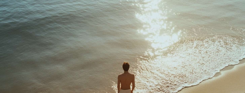 Man overlooks the ocean in Newport Beach to illustrate the benefits of ketamine treatment for mental health.