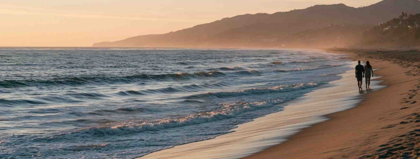 Couple walking along a Southern California beach, symbolizing hope and healing while being in a relationship with someone with PTSD.