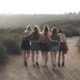 Five women walk together on a trail, illustrating connection and support during a residential mental health transition.
